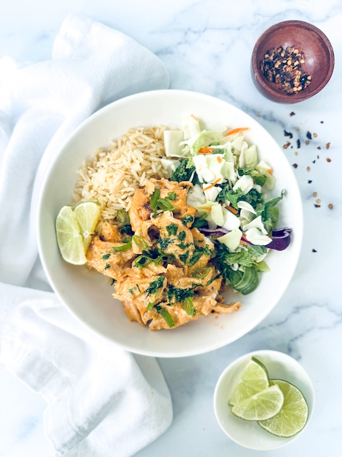 A bowl of Thai chicken curry over rice.