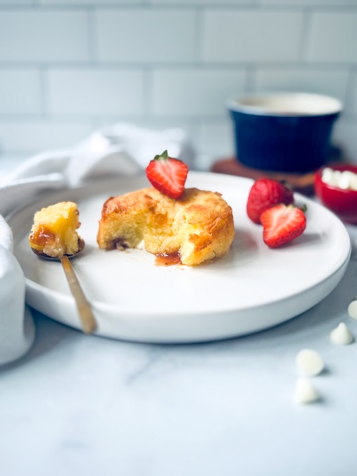 White chocolate strawberry lava cake on a plate.