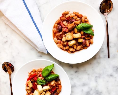 Two bowls of white bean cacciatore.