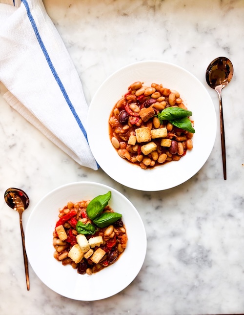 Two bowls of white bean cacciatore.
