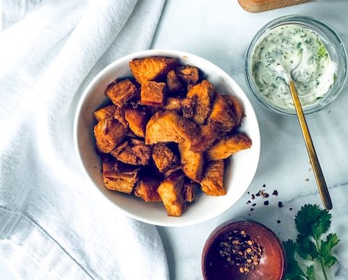 Diced hot honey chicken in a bowl for tacos.