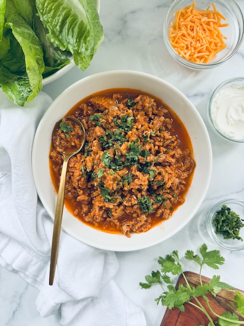 Large bowl of turkey taco filling for lettuce wraps.
