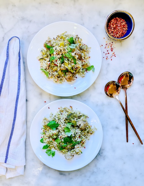 Rice with broccoli and sausage in two bowls.
