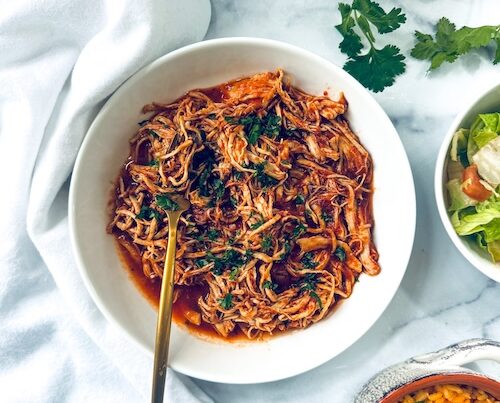 Bowl of shredded chipotle chicken.