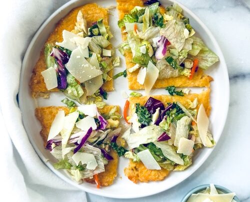 Canned chicken pizza crust topped with salad.
