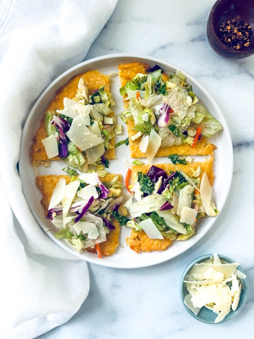 Canned chicken pizza crust topped with salad.