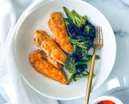 Hot honey harissa chicken with a side of broccoli.