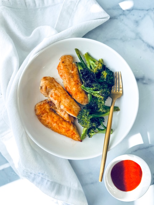 Hot honey harissa chicken with a side of broccoli.