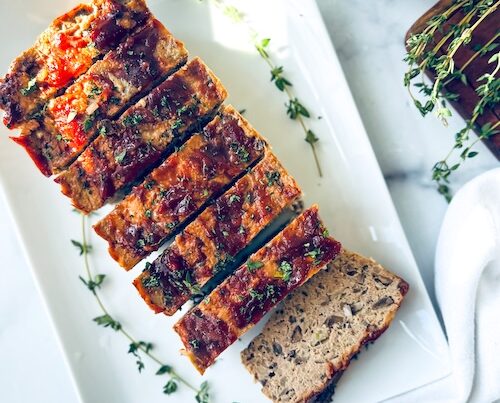 Turkey meatloaf sliced on a platter.