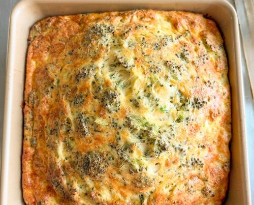 Broccoli cheddar egg bake in a casserole dish.