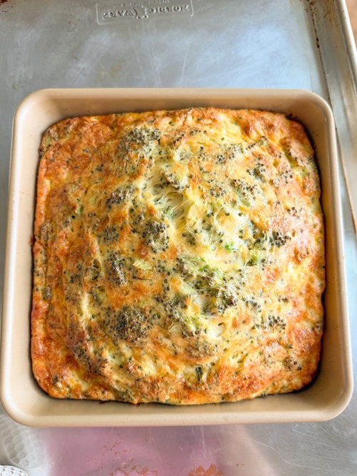 Broccoli cheddar egg bake in a casserole dish.