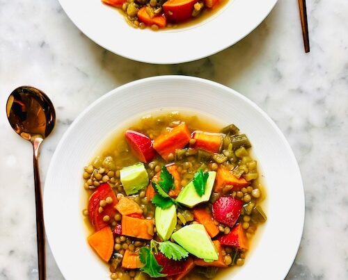 Two bowls of lentil sweet potato soup.