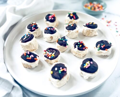 Frozen banana bites on a plate.