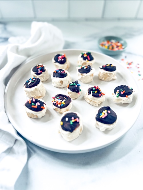 Frozen banana bites on a plate.