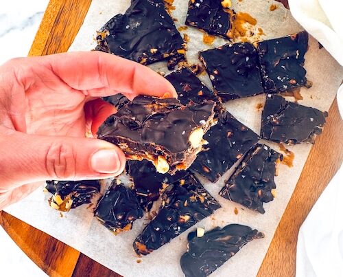 5-Ingredient Snickers date bark on a board.