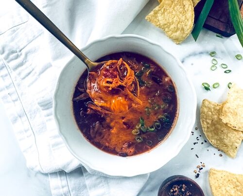 A bowl of cheesy chicken chili.