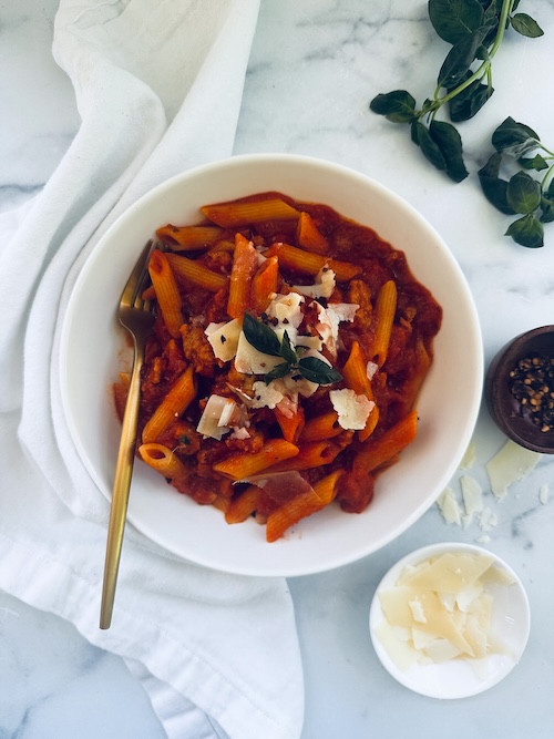 A bowl of Italian sausage pasta.