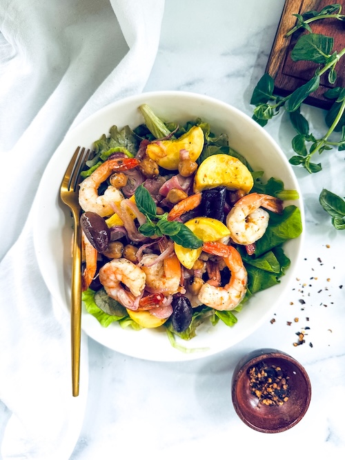 Shrimp and chickpeas over spinach.