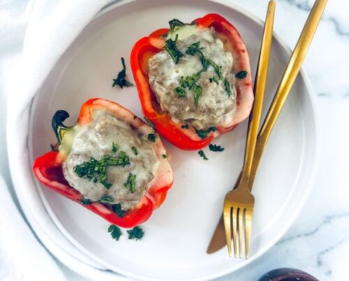 Philly Cheesesteak stuffed peppers on a plate.