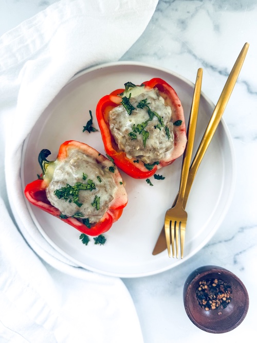 Philly Cheesesteak stuffed peppers on a plate.