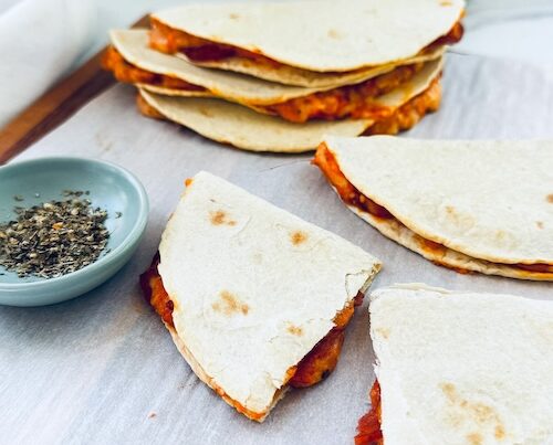 A stack of pizza tacos.