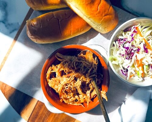 A bowl of shredded hot honey chicken.