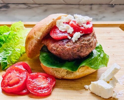 Greek turkey burgers with tomato and feta.