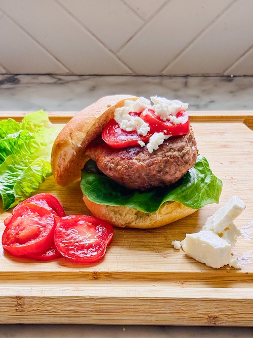 Greek turkey burgers with tomato and feta.