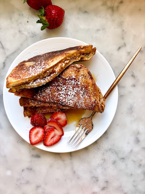 PBJ French Toast sandwiches on a plate.